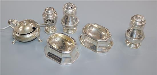 A pair of 1920s silver trencher salts by Tessiers Ltd, three other silver condiments and a silver mustard pot.